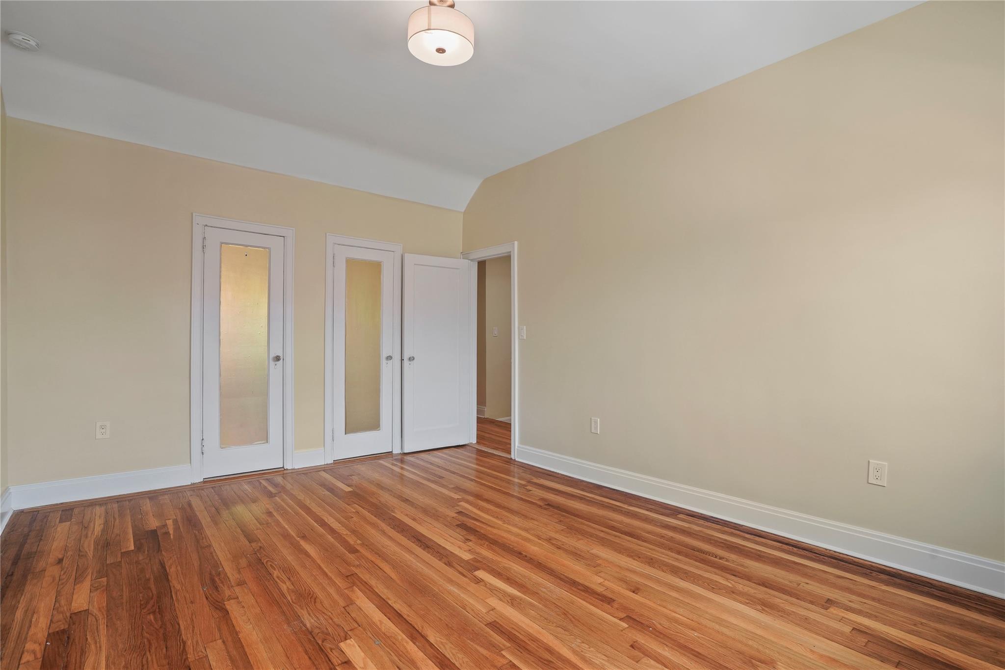 64-18 84th Place Queens, NY 11379 - Photo 27 of 35 a view of a room with wooden floor and closet