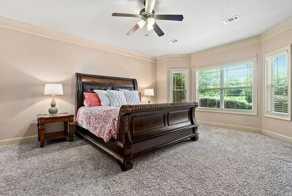 a bedroom with a bed and window