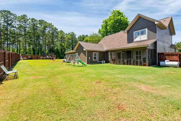 a view of a house with a swimming pool