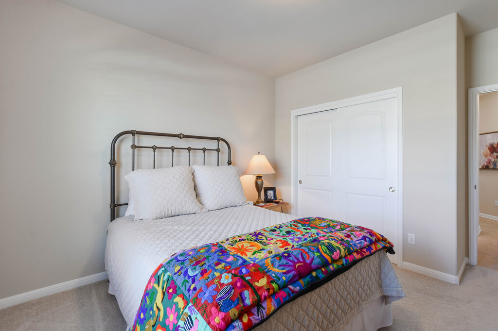 3451 Mayfield Ranch Boulevard, Unit 216 Round Rock, TX 78681 - Photo 26 of 33 a bedroom with a bed and a window