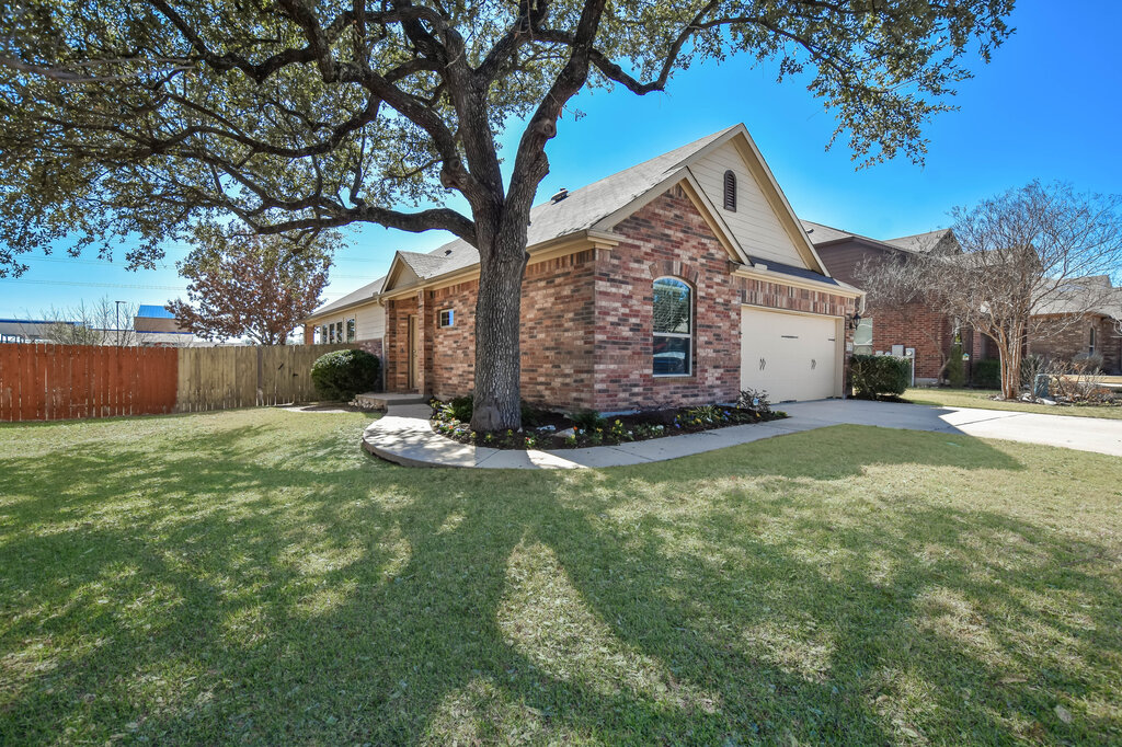 3451 Mayfield Ranch Boulevard, Unit 216 Round Rock, TX 78681 - Photo 3 of 33 a view of a house with backyard and tree