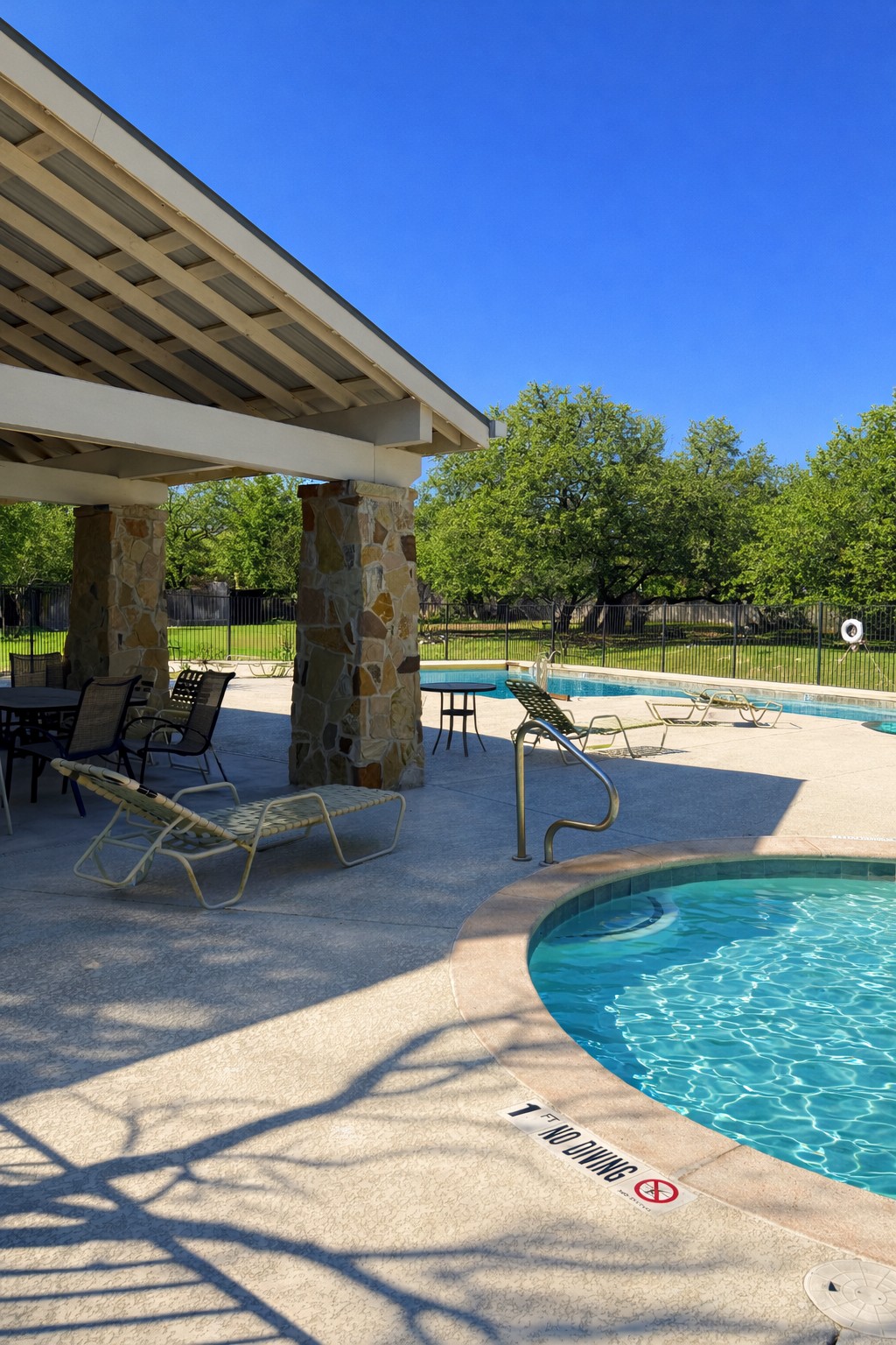 3451 Mayfield Ranch Boulevard, Unit 216 Round Rock, TX 78681 - Photo 31 of 33 a view of a swimming pool with a patio