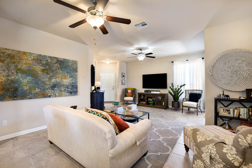 3451 Mayfield Ranch Boulevard, Unit 216 Round Rock, TX 78681 - Photo 7 of 33 a living room with furniture and a flat screen tv
