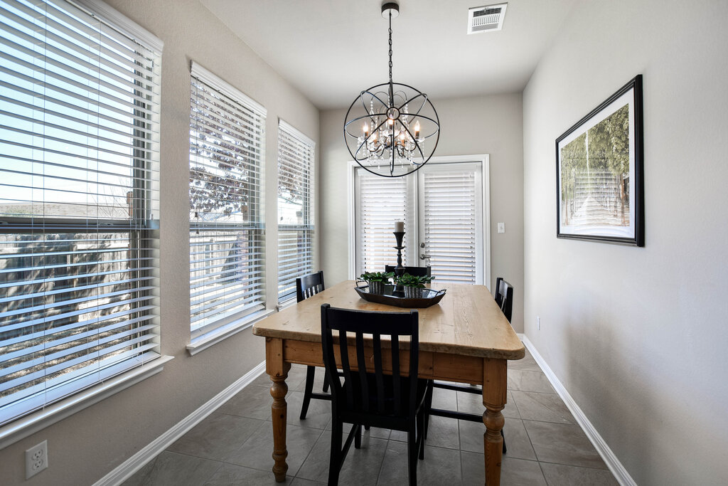 3451 Mayfield Ranch Boulevard, Unit 216 Round Rock, TX 78681 - Photo 9 of 33 a view of a dining room with furniture window and outside view