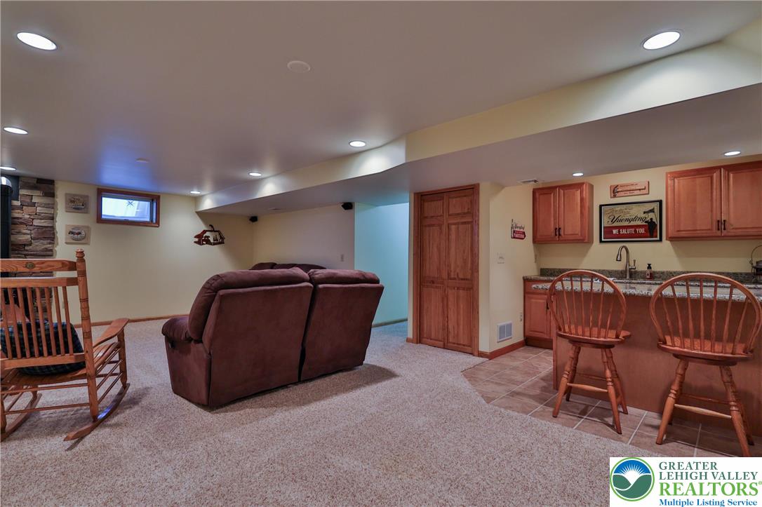 2053 Alice Drive Bethlehem, PA 18015 - Photo 24 of 31 a living room with furniture and a dining table with kitchen view