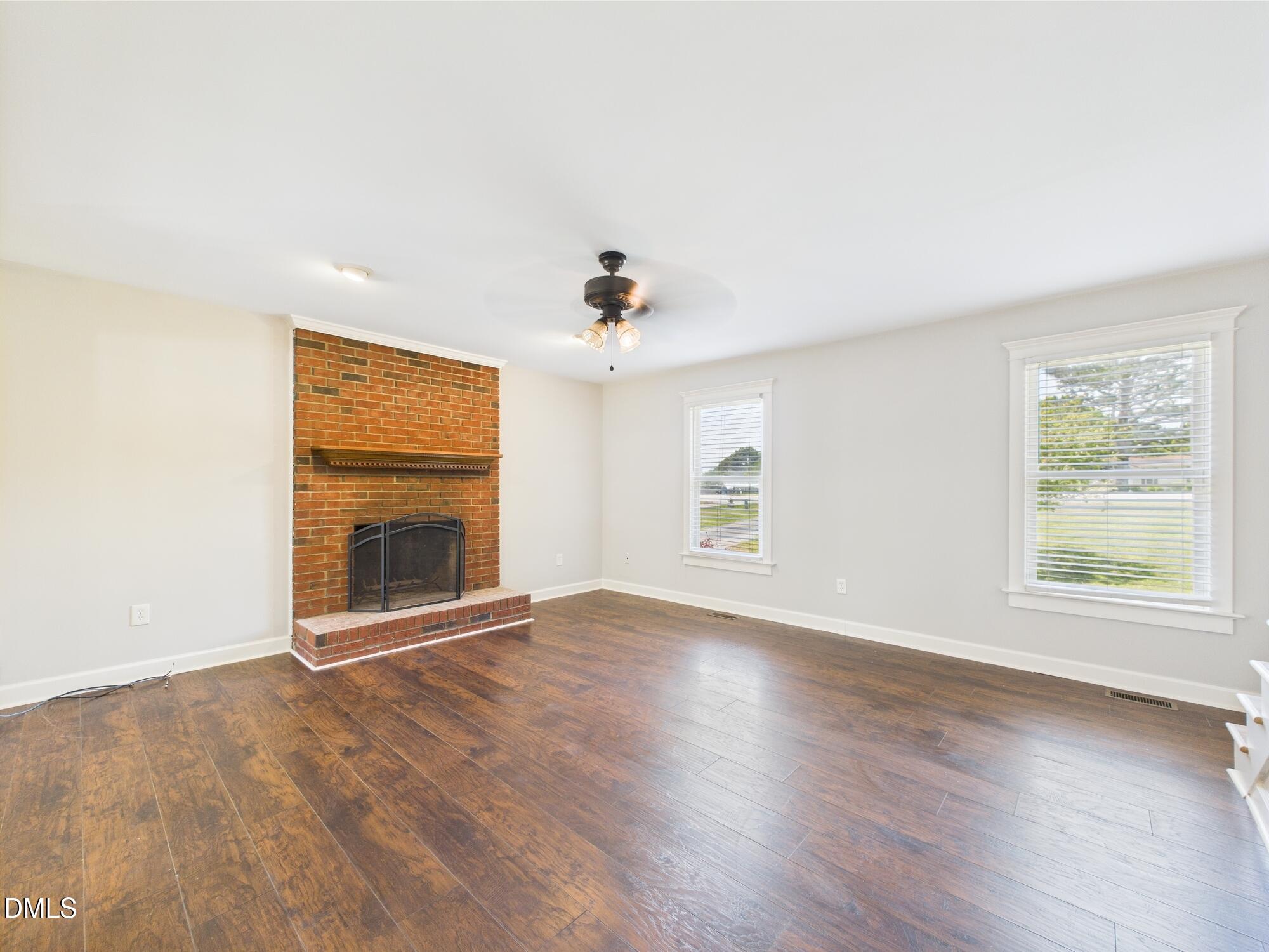 10917 Fanny Brown Road Raleigh, NC 27603 - Photo 16 of 54 an empty room with windows and fireplace
