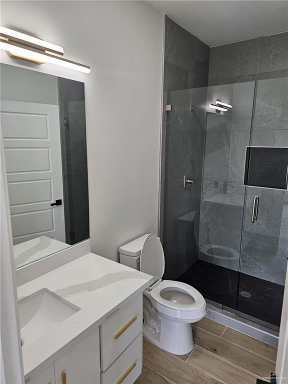 5500 North Crown Point Pharr, TX 78577 - Photo 17 of 39 a bathroom with a toilet a sink and shower