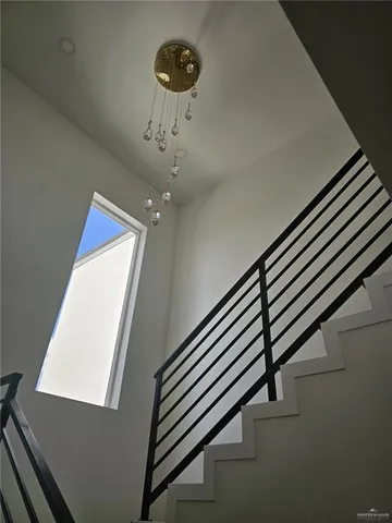 a view of a hallway with stairs