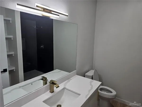 a bathroom with a sink and a toilet