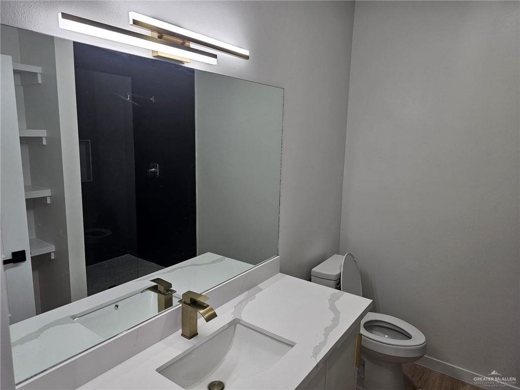 5500 North Crown Point Pharr, TX 78577 - Photo 22 of 39 a bathroom with a sink and a toilet