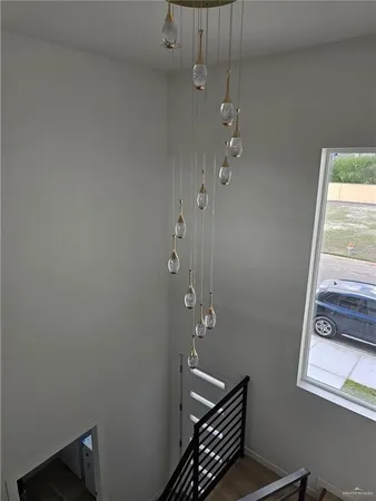 a bathroom with a window a toilet and a shower