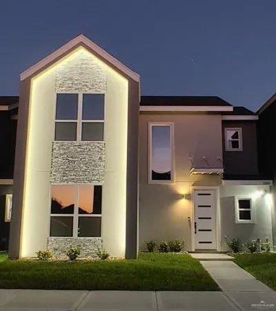 a front view of a house with a yard