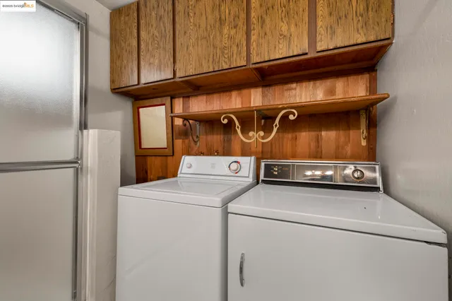 a bedroom with a bed and cabinet