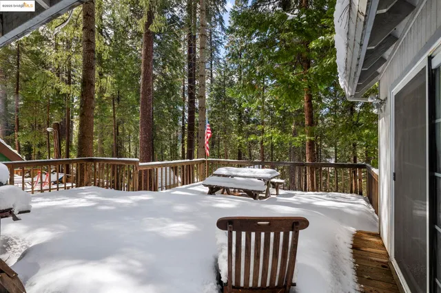 a view of a lake with boats and trees