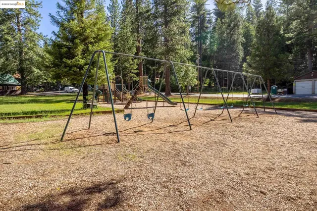 a view of a parking space with trees