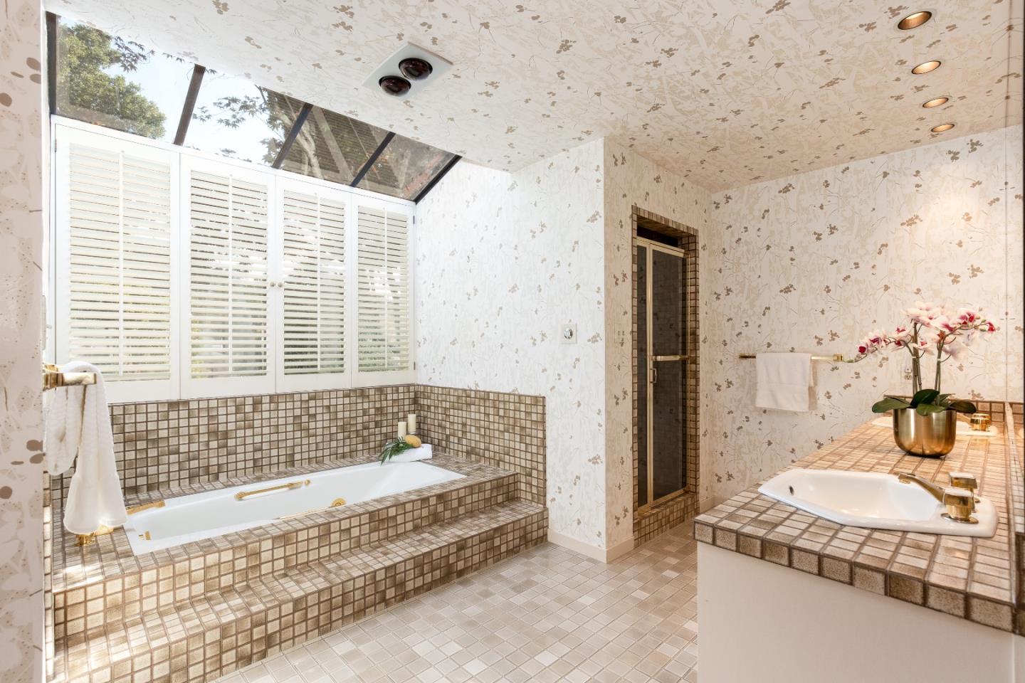 110 Stonepine Road Hillsborough, CA 94010 - Photo 18 of 28 a bathroom with a granite countertop bathtub and shower