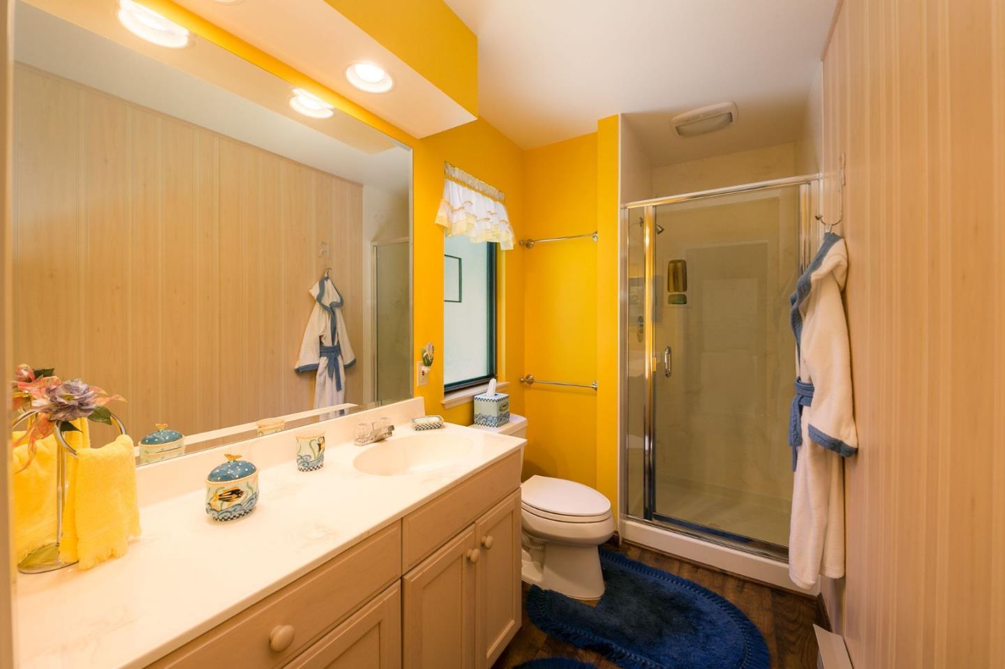 110 Stonepine Road Hillsborough, CA 94010 - Photo 22 of 28 a bathroom with a sink mirror toilet and shower