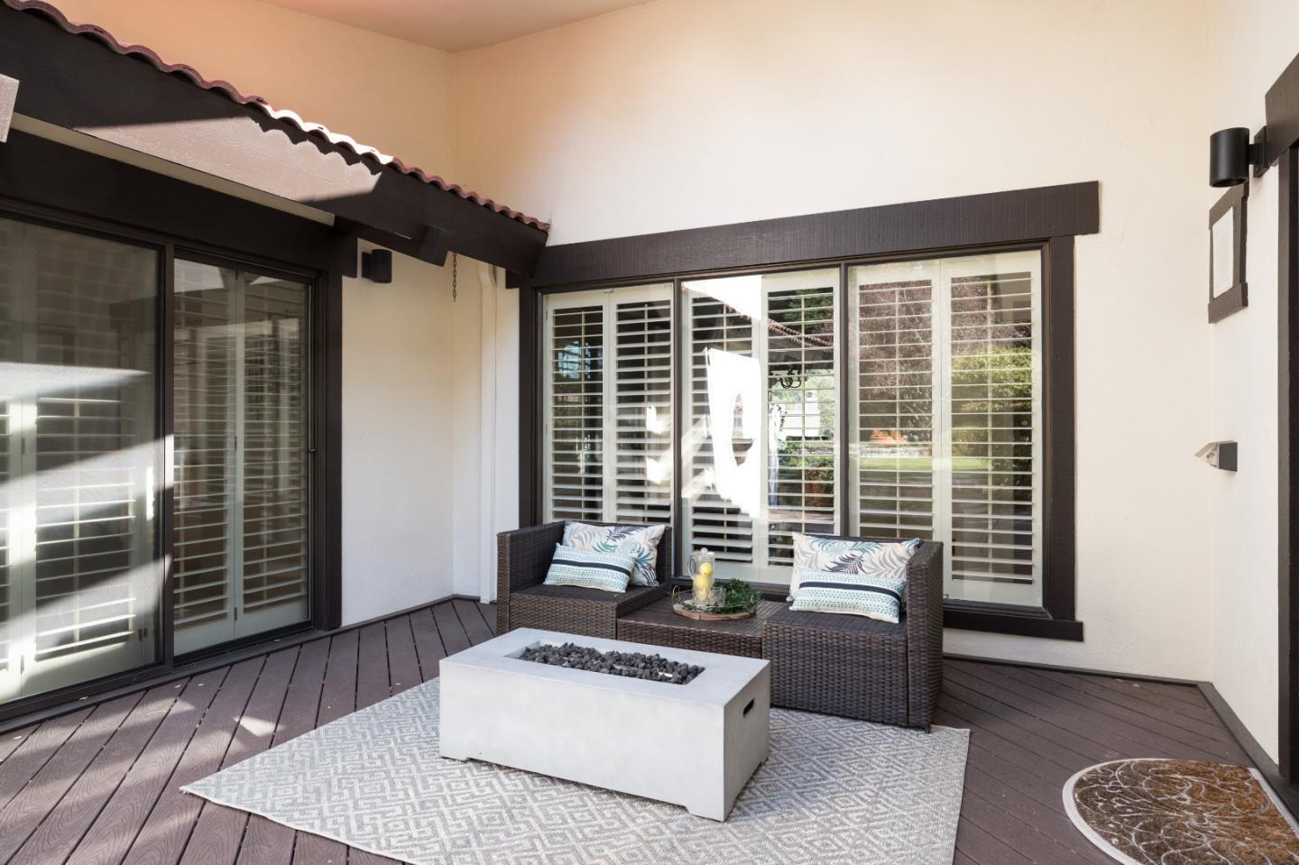 110 Stonepine Road Hillsborough, CA 94010 - Photo 23 of 28 a living room with furniture and wooden floor