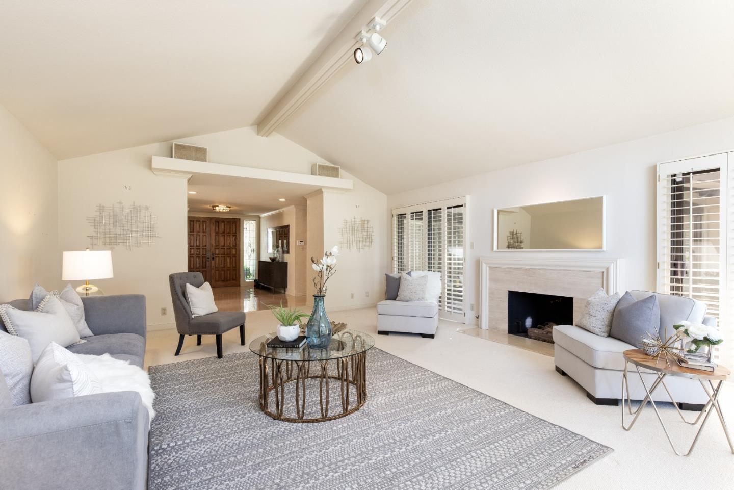 110 Stonepine Road Hillsborough, CA 94010 - Photo 7 of 28 a living room with furniture and a fireplace