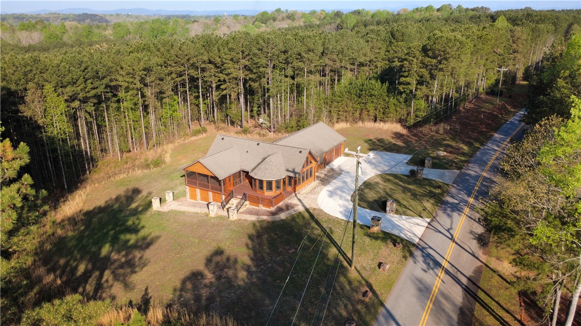 128 McAlister Road West Union, SC 29696 - Photo 8 of 40 Mature woodlands frame this private mountain retreat with an expansive paved driveway.