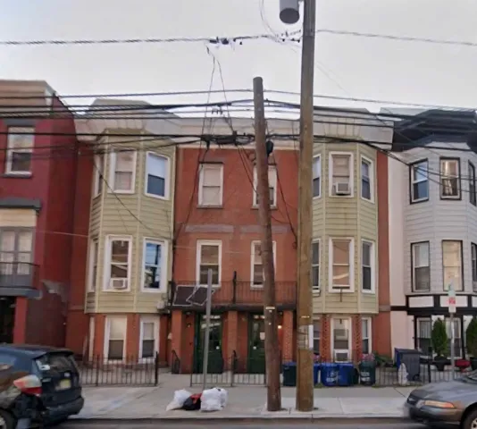 a front view of a building and a street