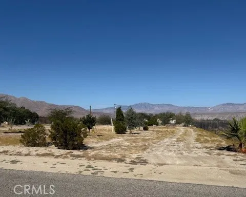 a view of a road with mountains
