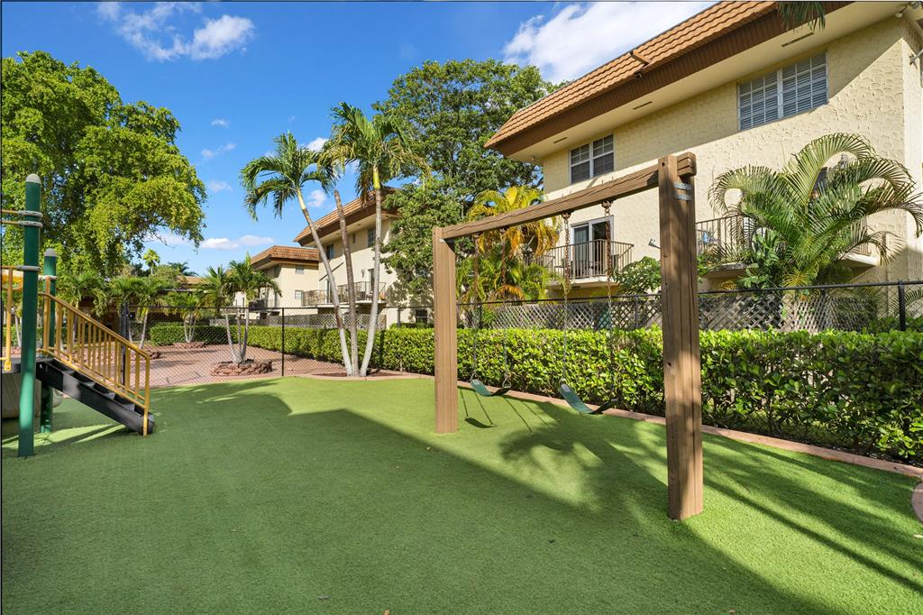 8600 Southwest 109th Avenue, Unit 4101 Miami, FL 33173 - Photo 1 of 34 a view of an house with backyard and tree