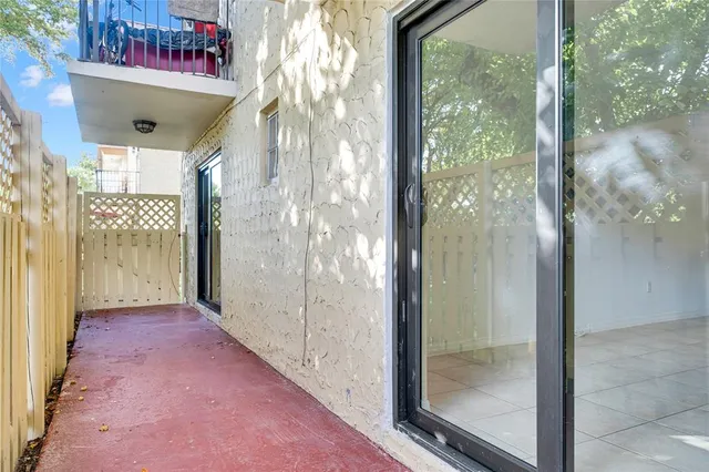 a kitchen with cabinets and refrigerator
