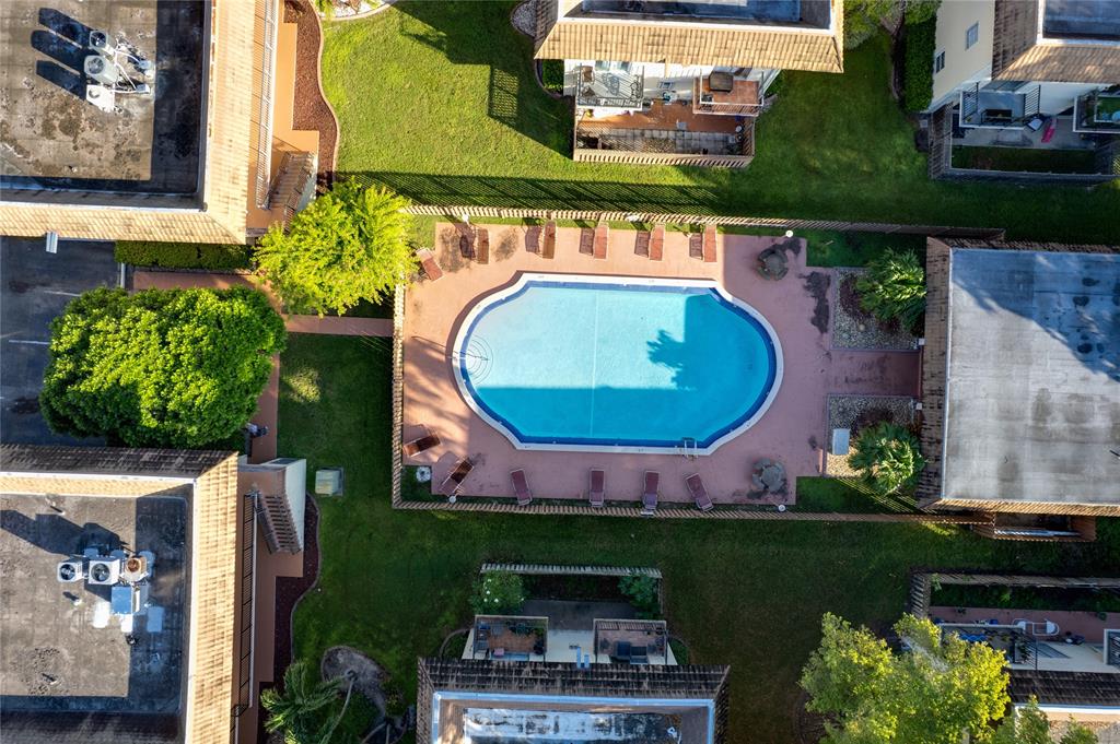 8600 Southwest 109th Avenue, Unit 4101 Miami, FL 33173 - Photo 32 of 34 an aerial view of a house with a garden and a swimming pool