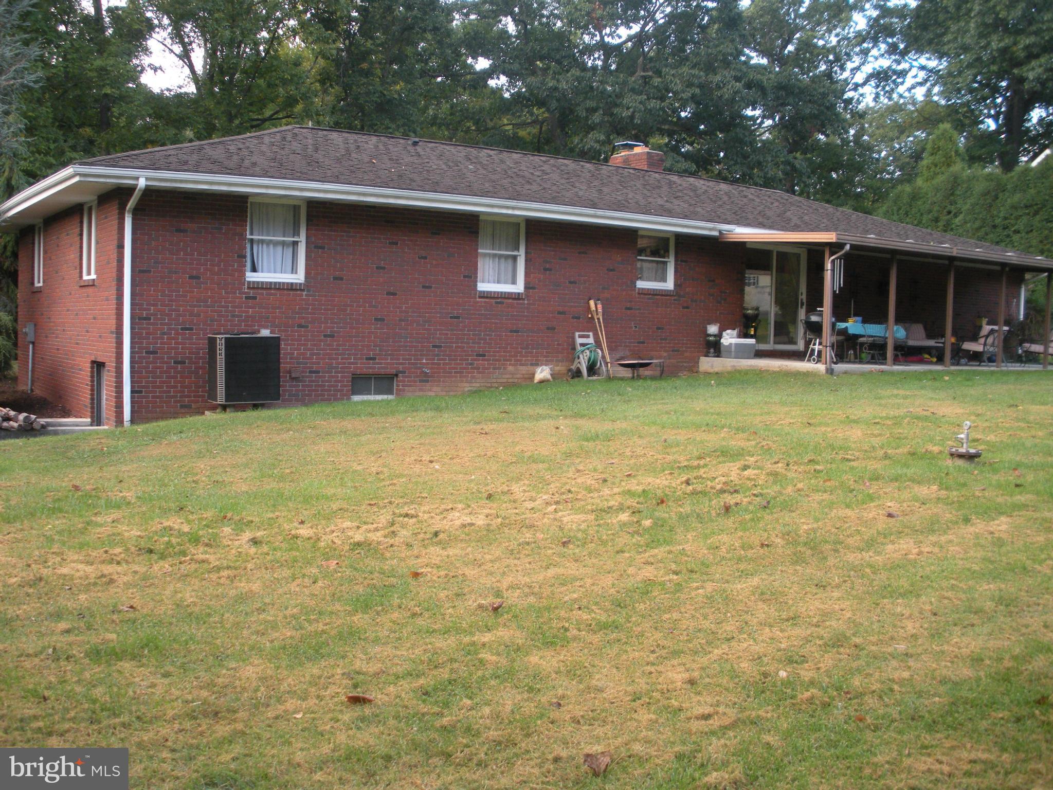 12309 Gramlich Road Southwest La Vale, MD 21502 - Photo 26 of 30 a front view of a house with garden