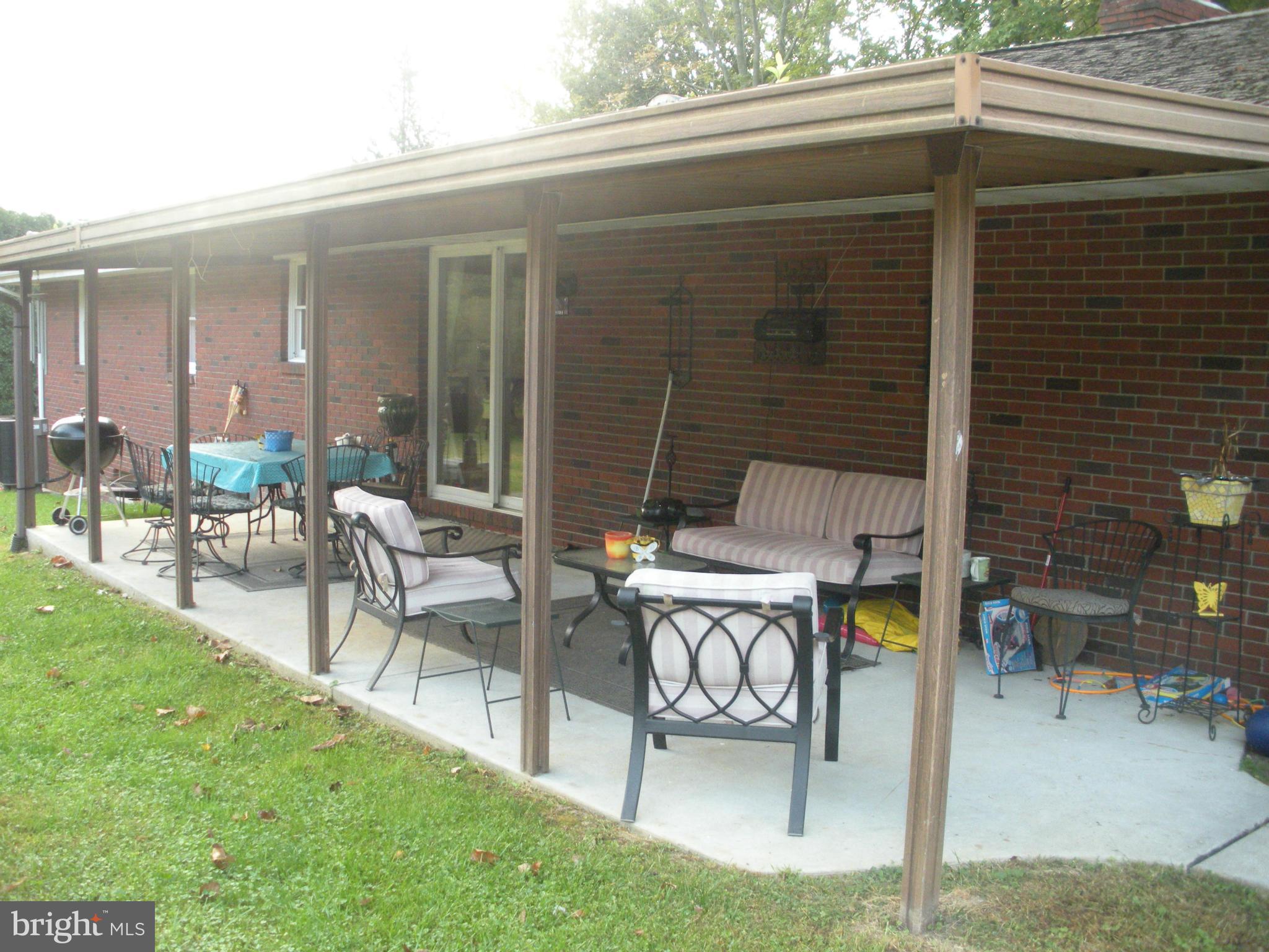 12309 Gramlich Road Southwest La Vale, MD 21502 - Photo 27 of 30 a patio with table and chairs