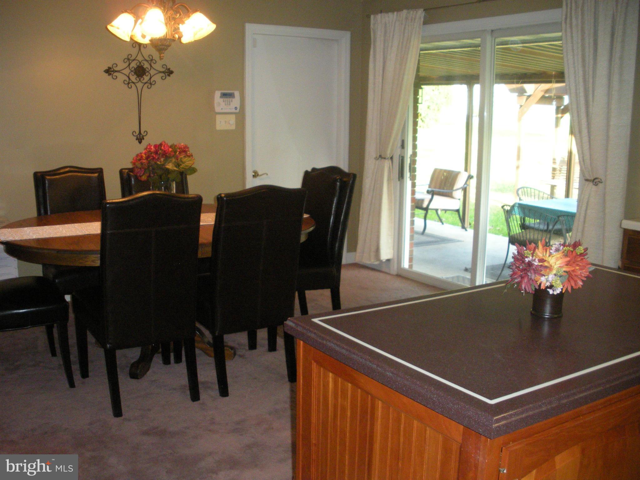 12309 Gramlich Road Southwest La Vale, MD 21502 - Photo 5 of 30 a view of a dining room with furniture and chandelier