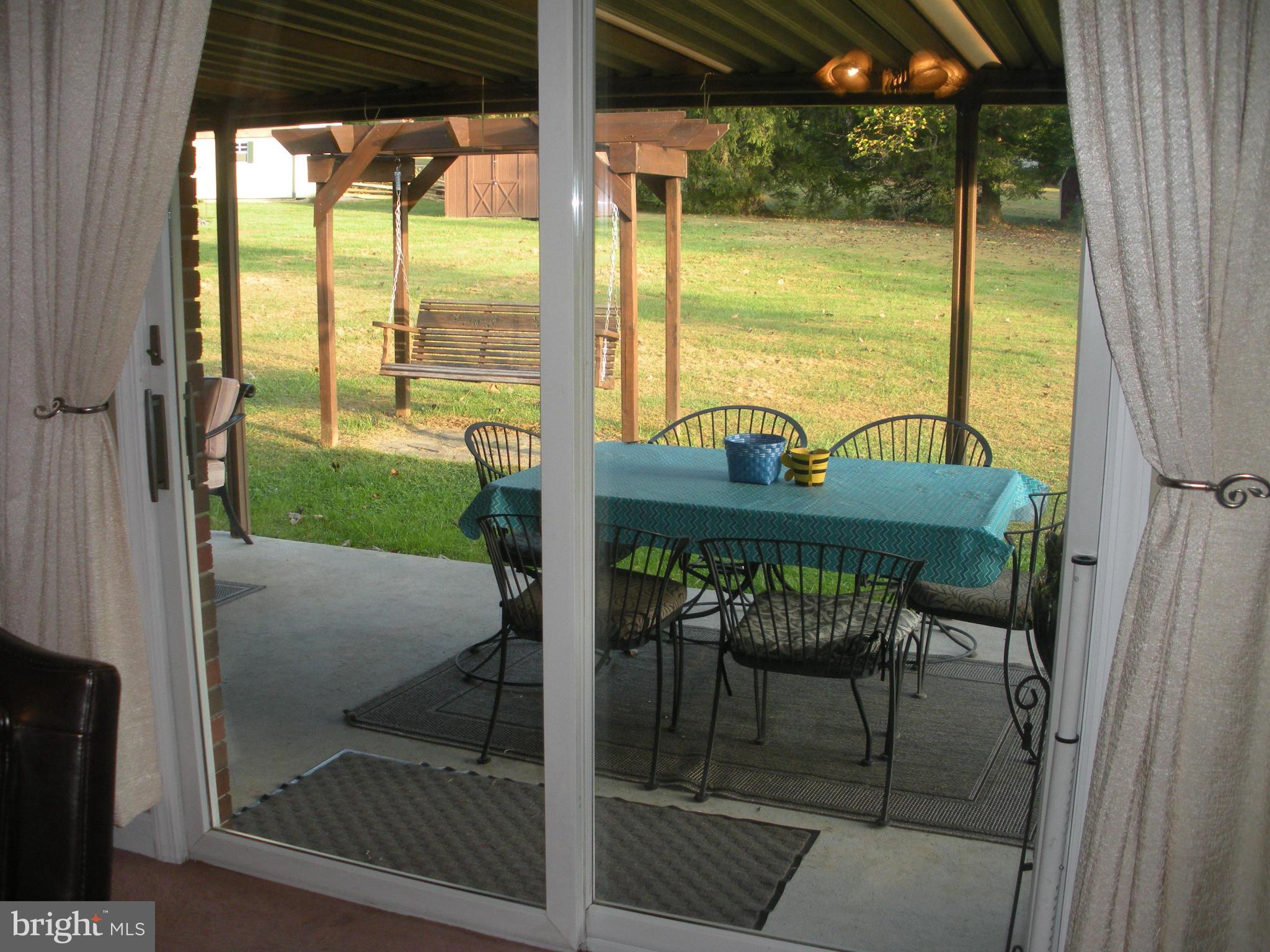 12309 Gramlich Road Southwest La Vale, MD 21502 - Photo 8 of 30 a view of balcony with a table and chairs