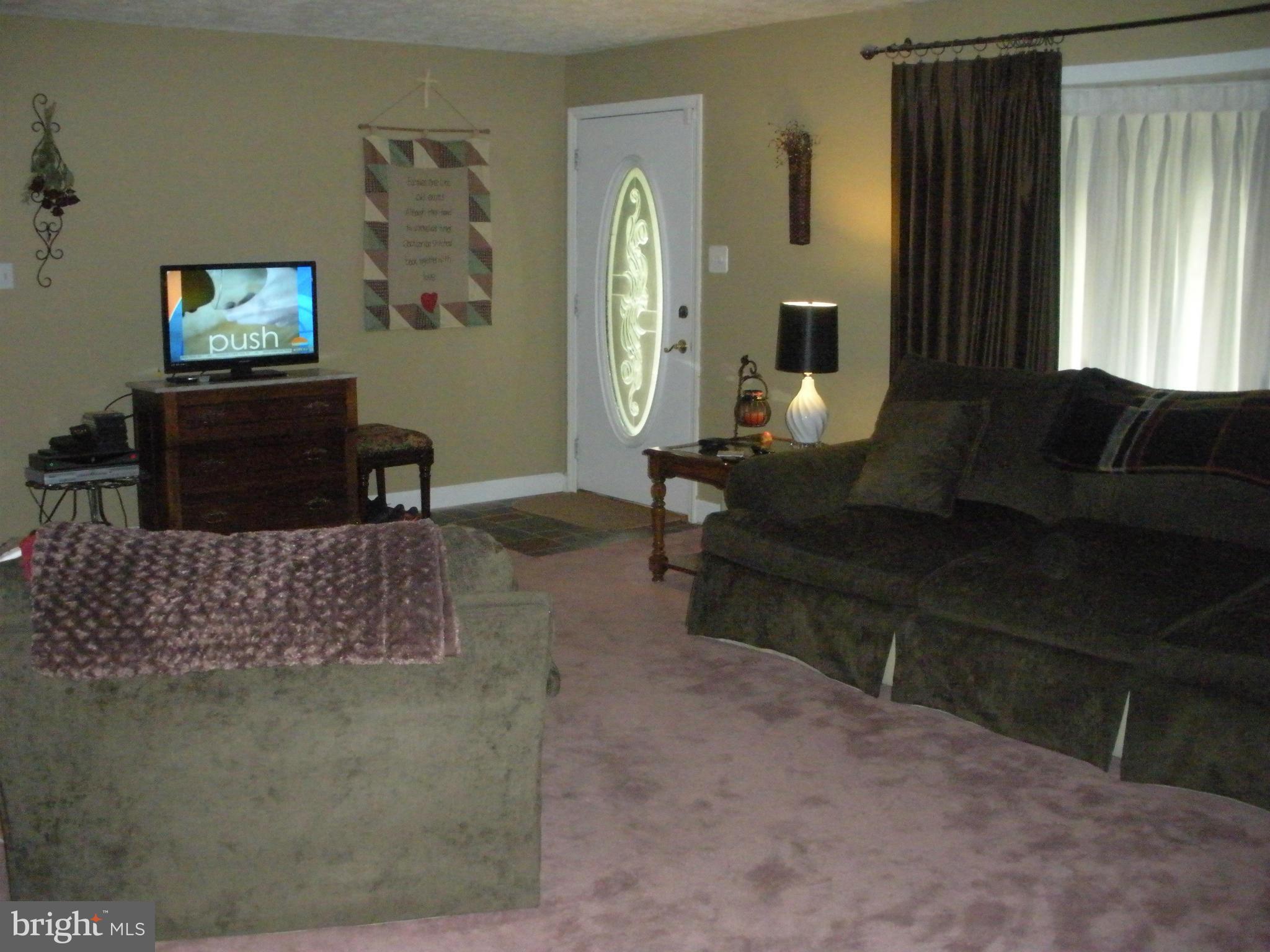 12309 Gramlich Road Southwest La Vale, MD 21502 - Photo 9 of 30 a living room with furniture and a flat screen tv