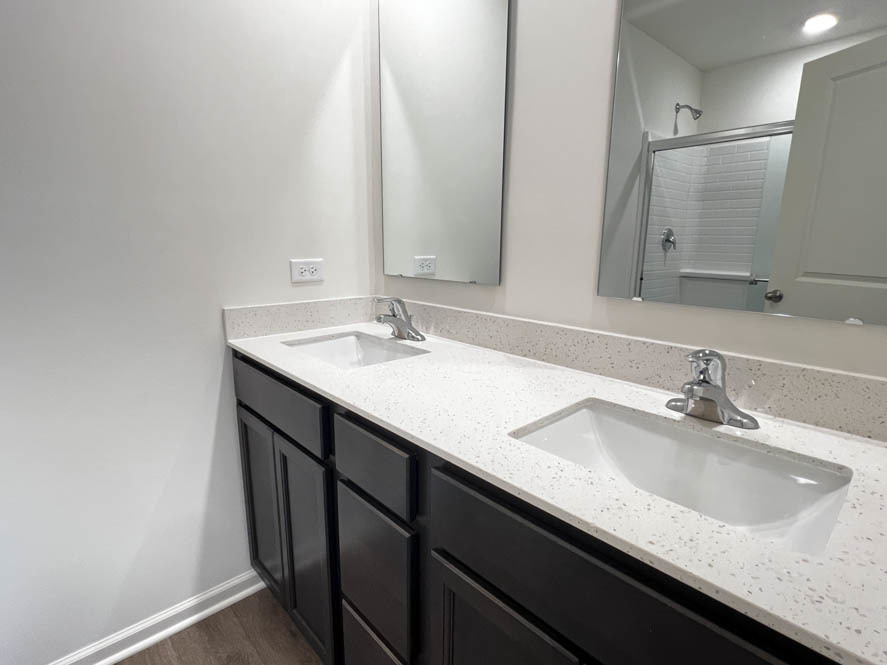 392 Summit Circle Lombard, IL 60148 - Photo 8 of 61 a bathroom with a granite countertop sink and a mirror