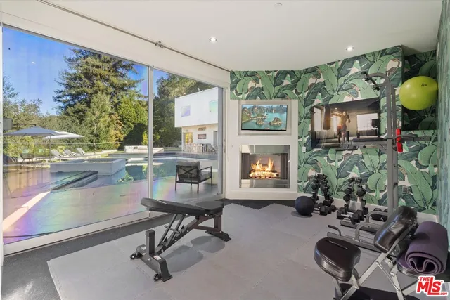 a room with musical instrument pool table and chairs