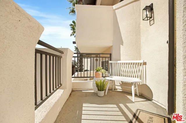 a view of a hallway with chairs