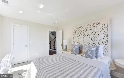 a bedroom with a bed and a table