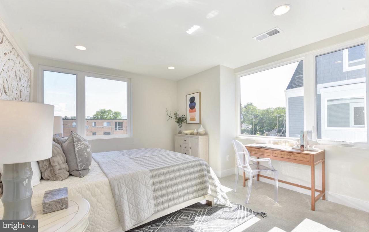 2815 24th Road South Arlington, VA 22206 - Photo 14 of 27 a bedroom with a bed and a table