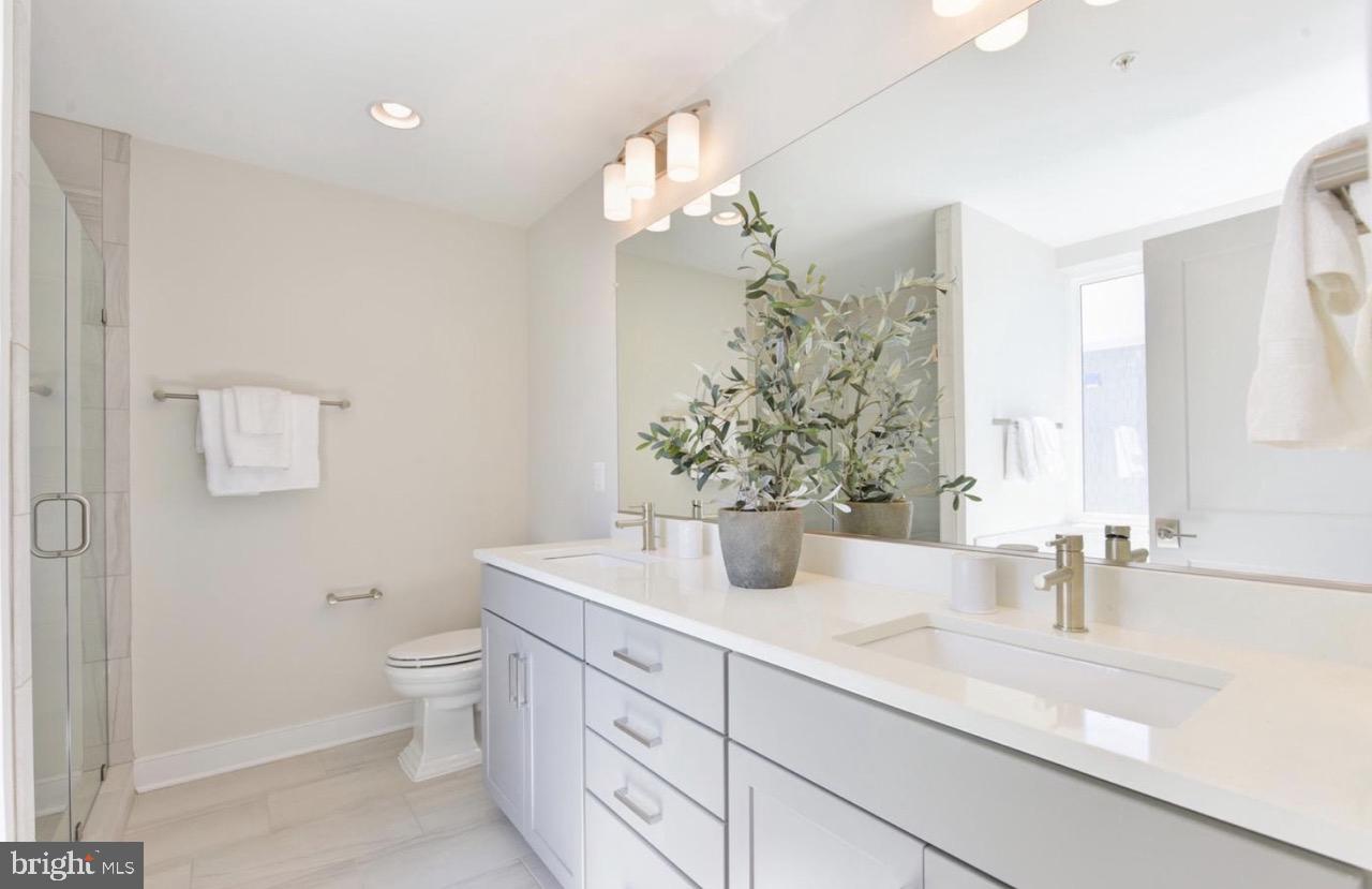 2815 24th Road South Arlington, VA 22206 - Photo 15 of 27 a bathroom with a sink a toilet and a mirror