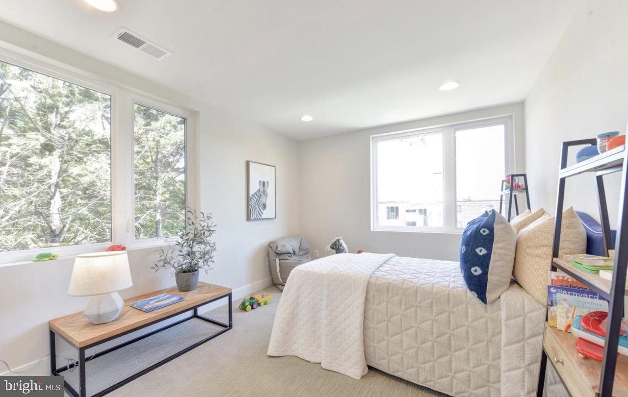 2815 24th Road South Arlington, VA 22206 - Photo 19 of 27 a bedroom with a bed and wooden floor