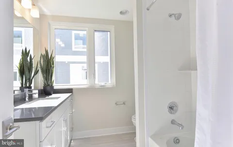 a bedroom with a bed and a table