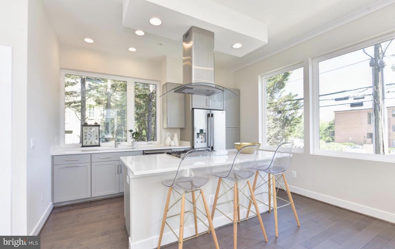 2815 24th Road South Arlington, VA 22206 - Photo 9 of 27 a dining hall with stainless steel appliances granite countertop a stove and a large window