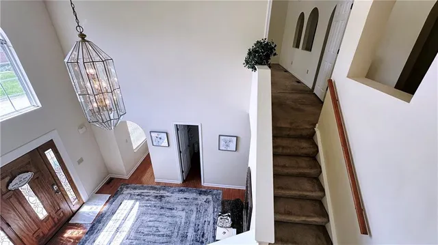 a view of an entryway with wooden floor