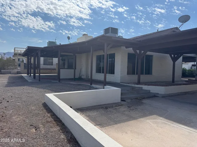a view of a hallway with entryway and window