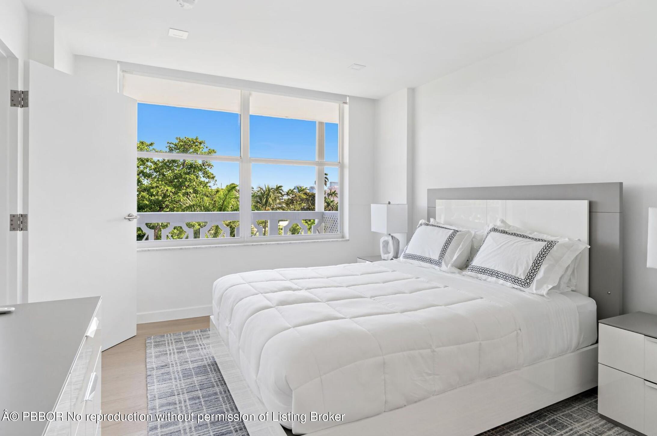 333 Sunset Avenue, Unit 512 Palm Beach, FL 33480 - Photo 17 of 29 a bedroom with a bed mirror and window