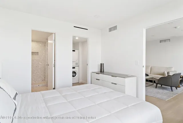 a bedroom with a bed and a couch