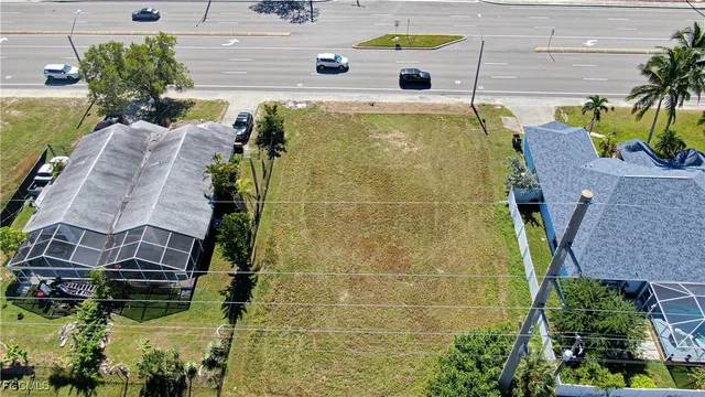 a aerial view of a house with a yard
