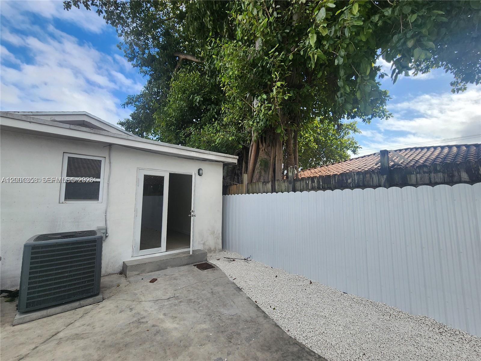 1726 Southwest 25th Avenue, Unit 1 Miami, FL 33145 - Photo 12 of 14 a view of a house with a outdoor space