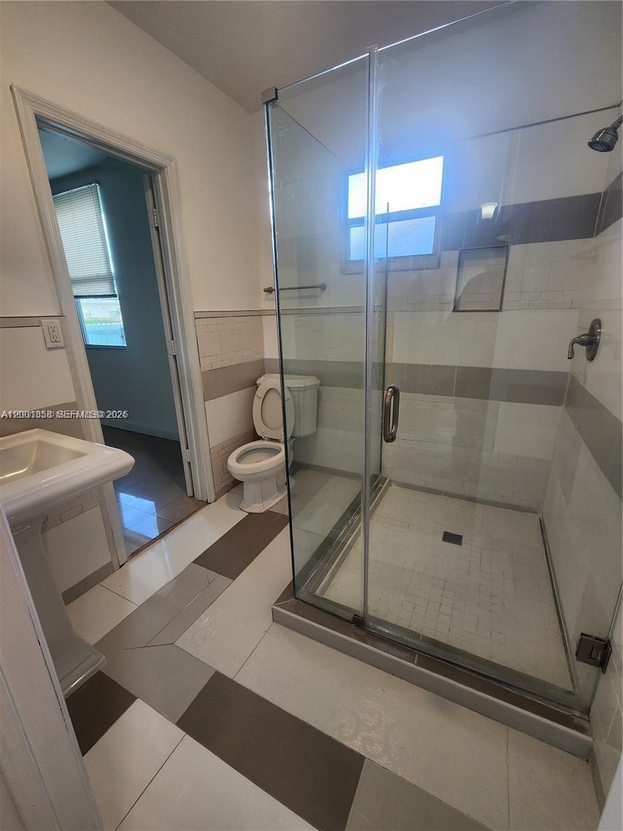 1726 Southwest 25th Avenue, Unit 1 Miami, FL 33145 - Photo 7 of 14 a bathroom with a shower